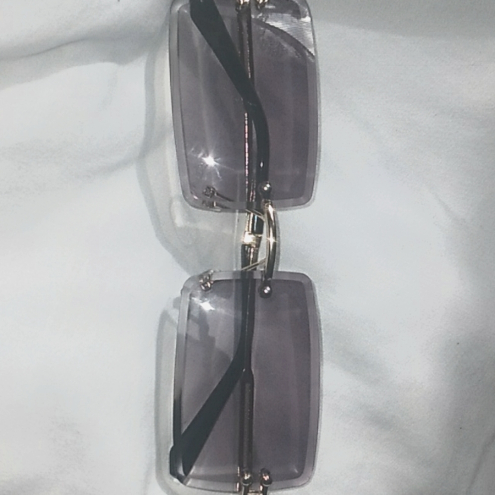 Rimless square shaped classic luxury-looking glasses.